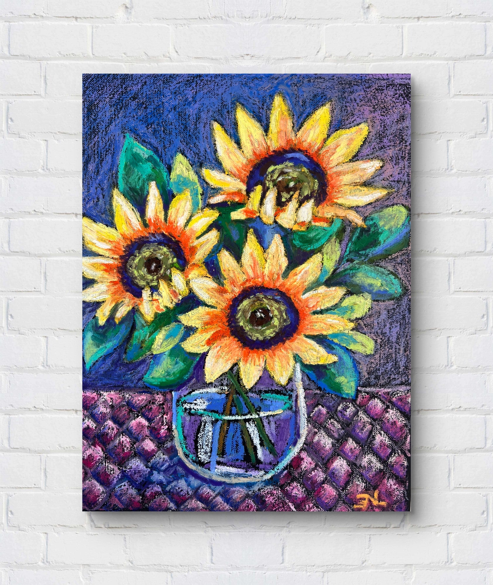 Colorful painting of sunflowers in a vase on a white brick wall.